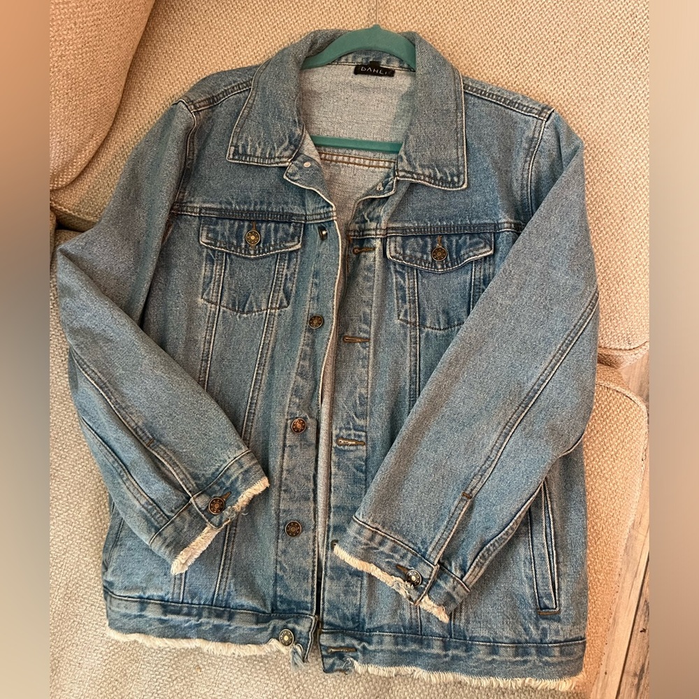 Denim jacket, lighter wash, fringed ends